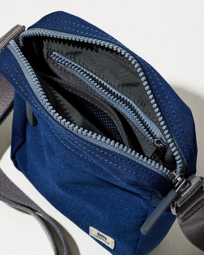 Tommy Bahama Bond Deep Blue Canvas Crossbody